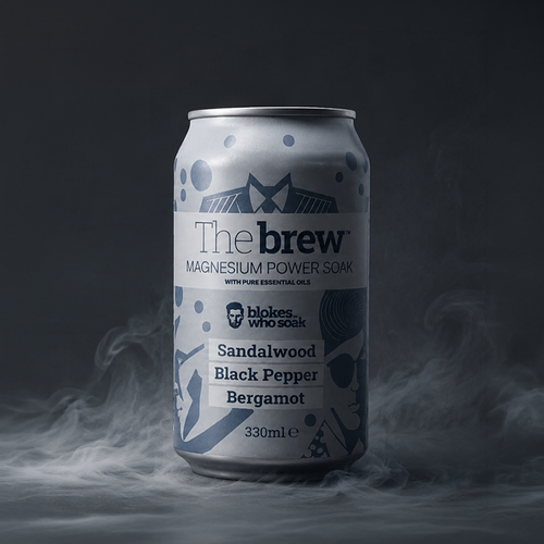 Silver can labeled 'The brew' with branding and product details on a dark , steamy background